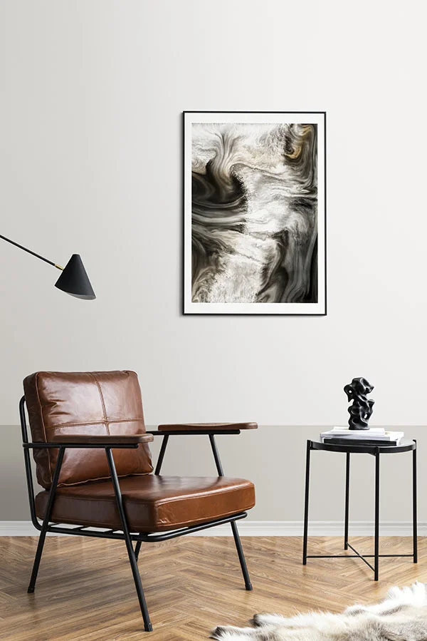 Framed artwork displayed beside a coffee table in a living room